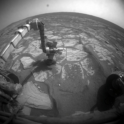 rocky opportunity looks at a rock on mars