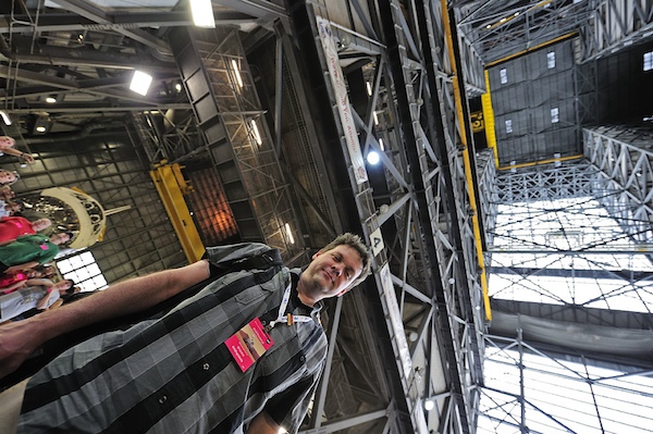 The author in the Vehicle Assembly Building. Endeavour is at the left and the indescribably tall high bay ceiling is at the right. Credit: Glenn Eisen